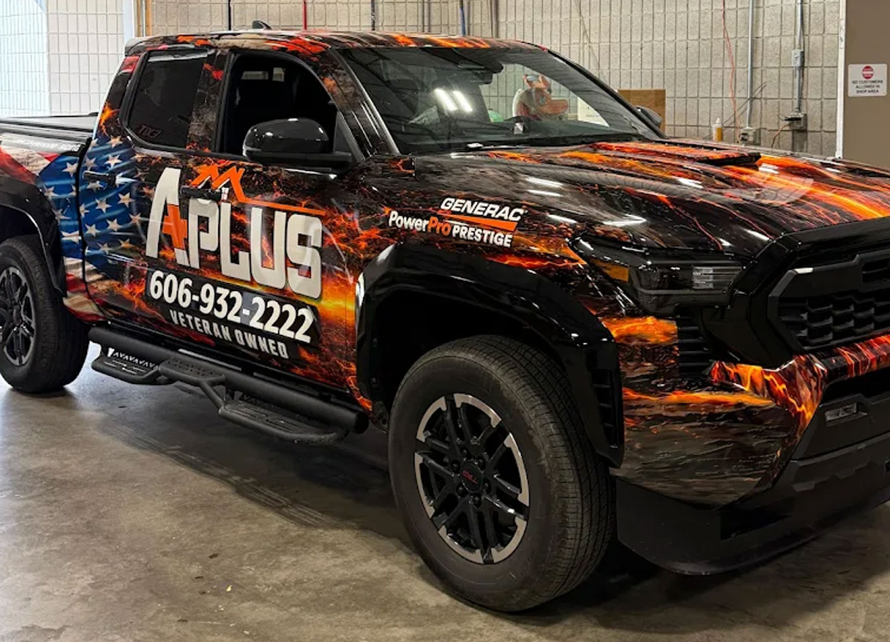 A Plus Signs & Graphics wrapped work truck